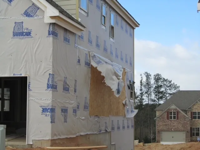 Torn housewrap left unrepaired before siding